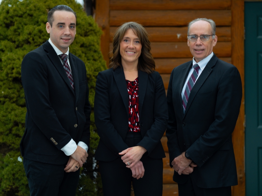 Ed & Corbin Curley and Jody Angellotti, financial advisors at Curley Wealth Management, pose outside their office in Oneonta, NY